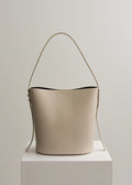 LEO BUCKET BAG - CEMENT VITELLO